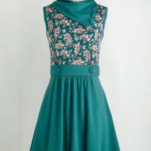 Floral teal dress with pockets and mock buttons!